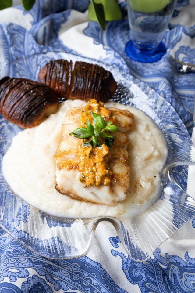 Butter-fried Hake with Cauliflower Puree, Hasselback Potatoes and Red Pesto
