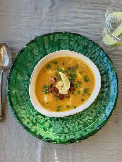 Carrot soup with cod and bacon