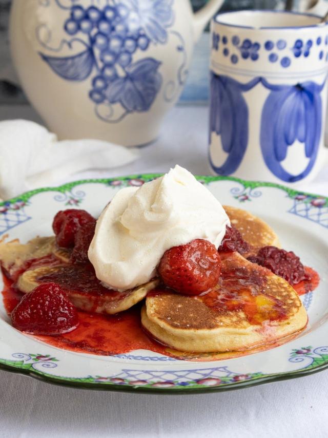 Fluffy Pancakes with Warm Strawberry Jam, topped with Whipped Cream